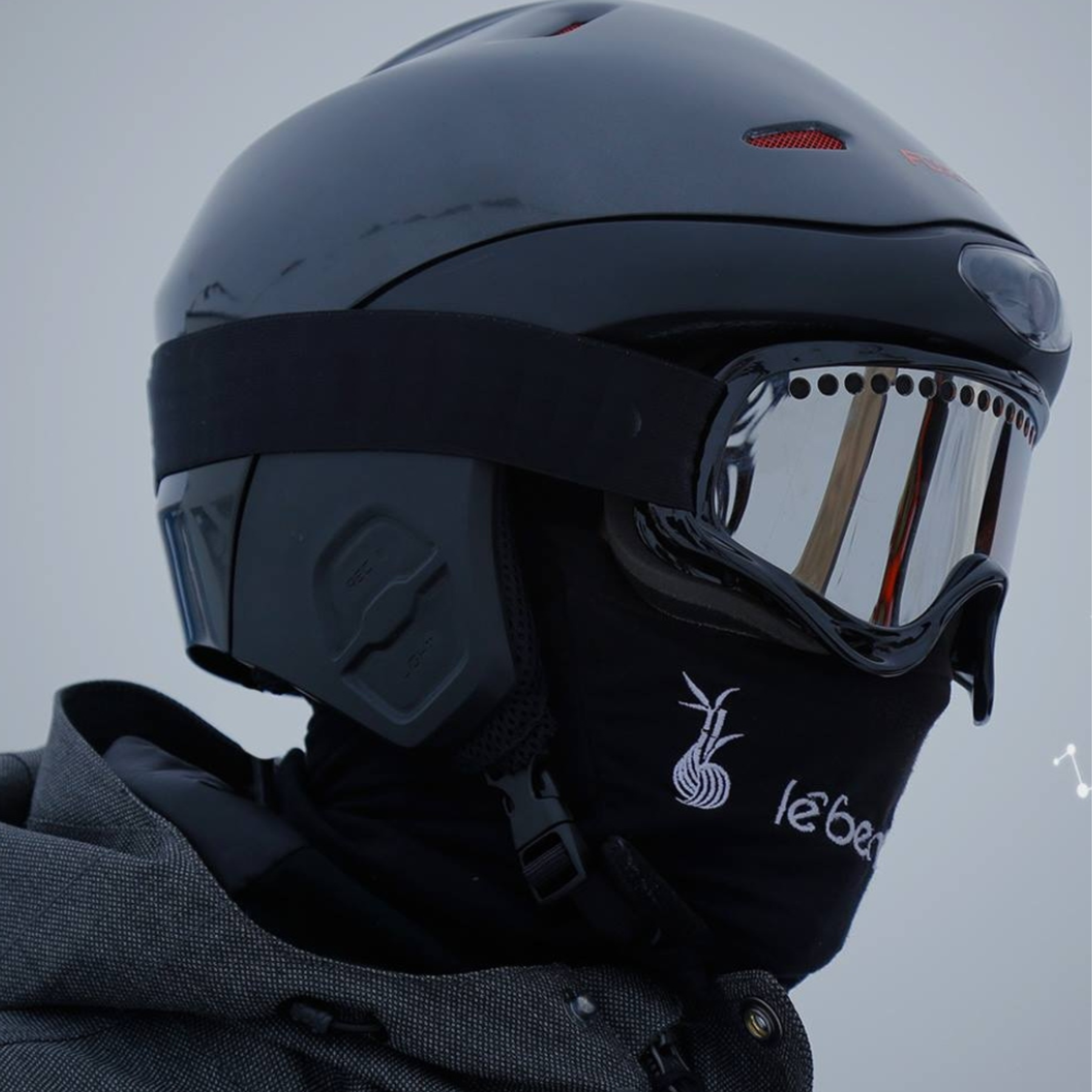 Side view snowboarder man wear black suit goggles mask hat ski
